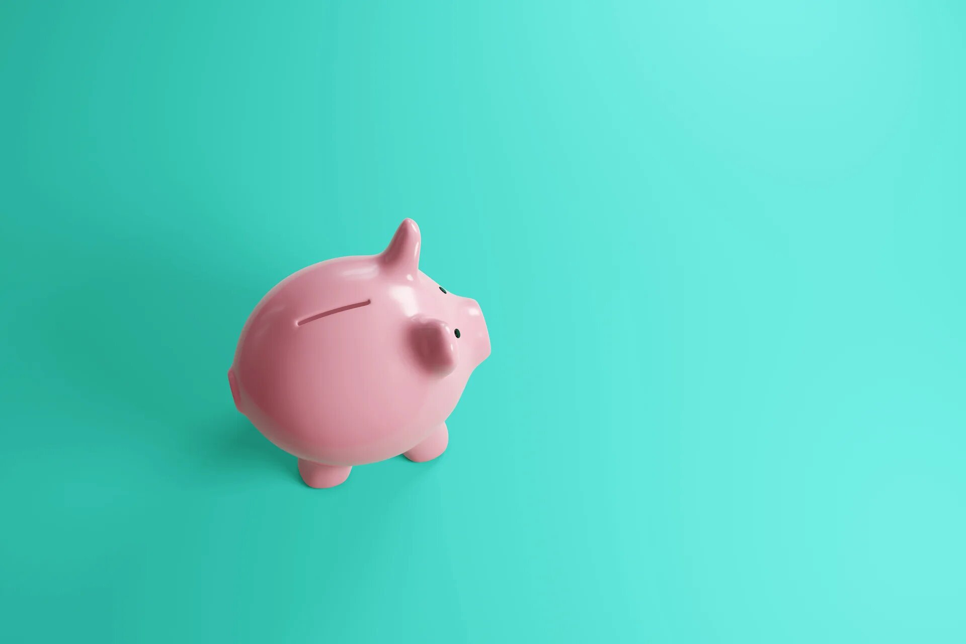 Tirelire forme cochon rose sur fond vert